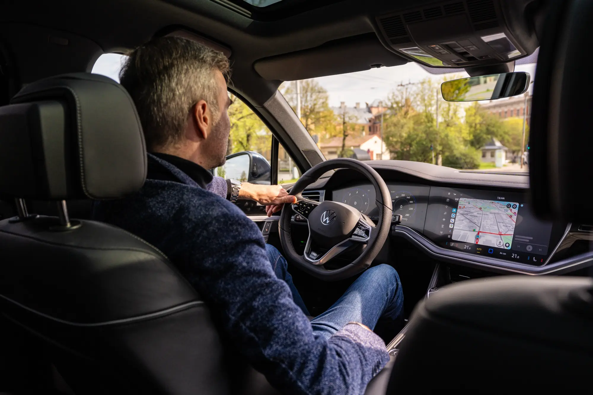 Man driving after recovering from rotator cuff surgery