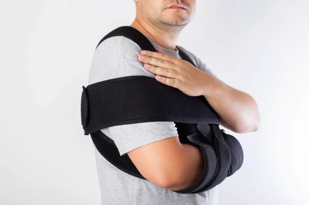 patient in sling after shoulder surgery